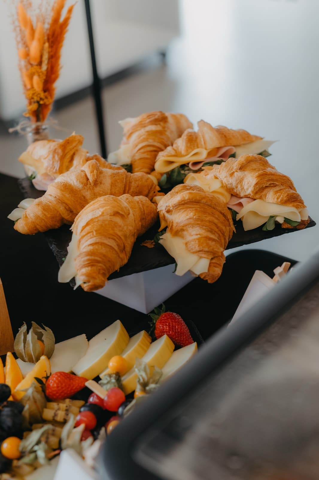 Filled croissants and a fruit platter