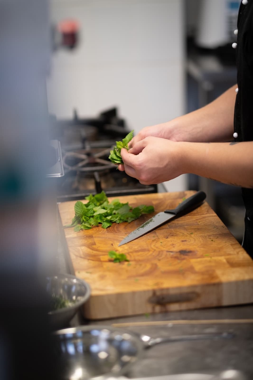 Chef preparing fresh herbs